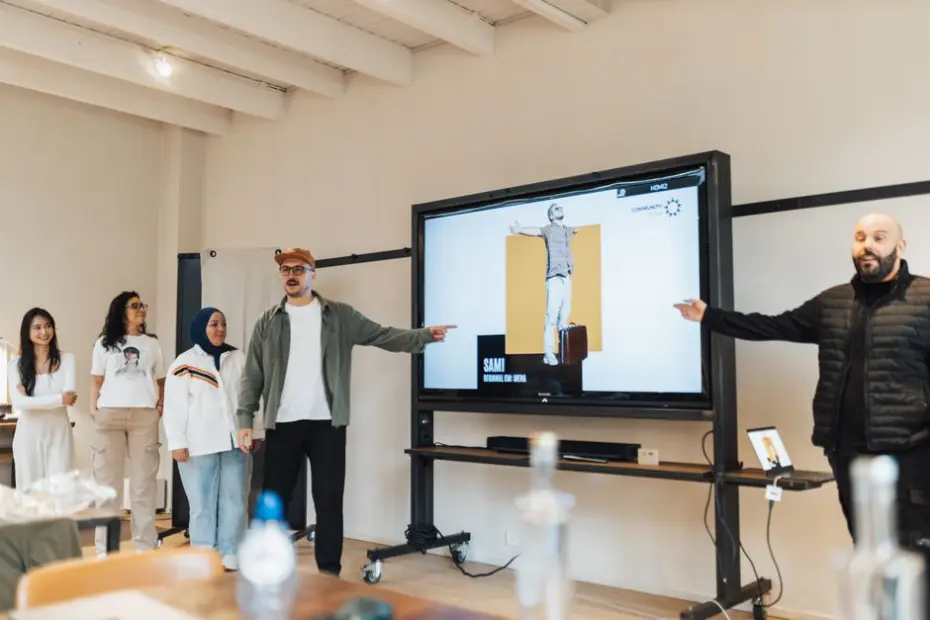 Diverse team delivering a digital presentation in a modern office environment.