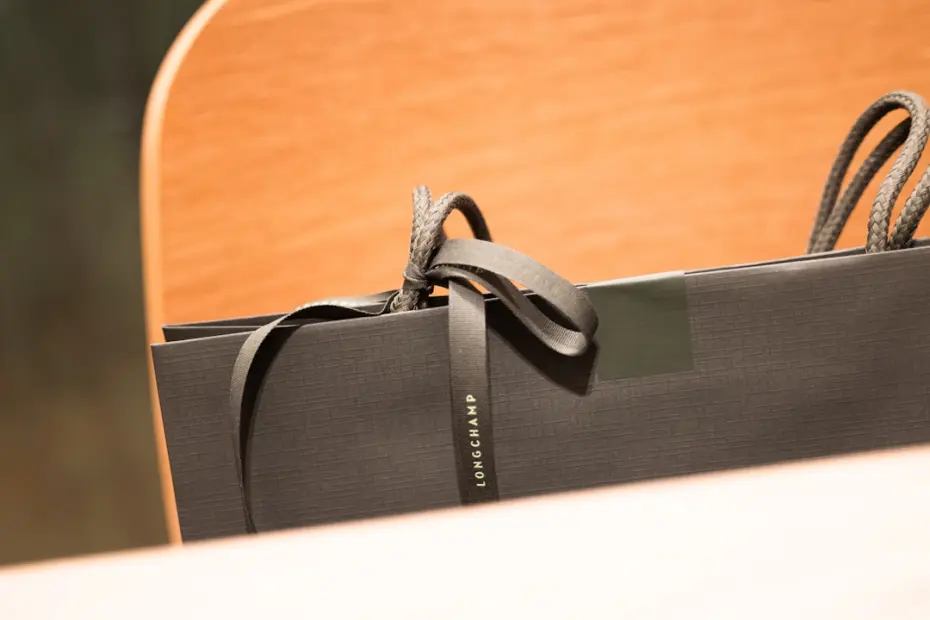 Black shopping bag with ribbon tied
