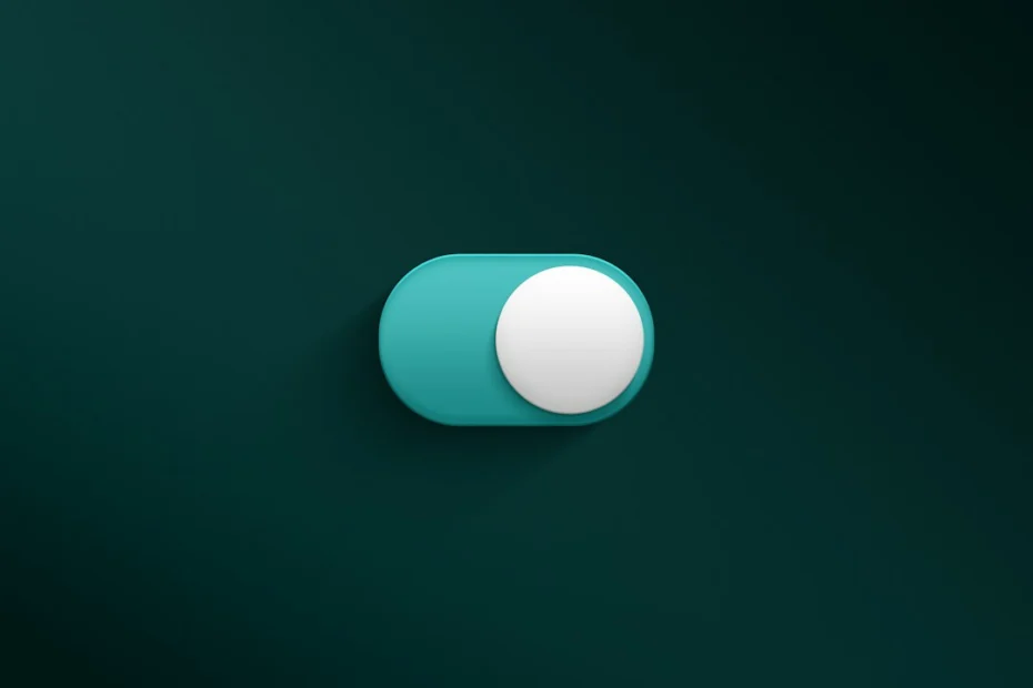 a blue and white button on a green wall
